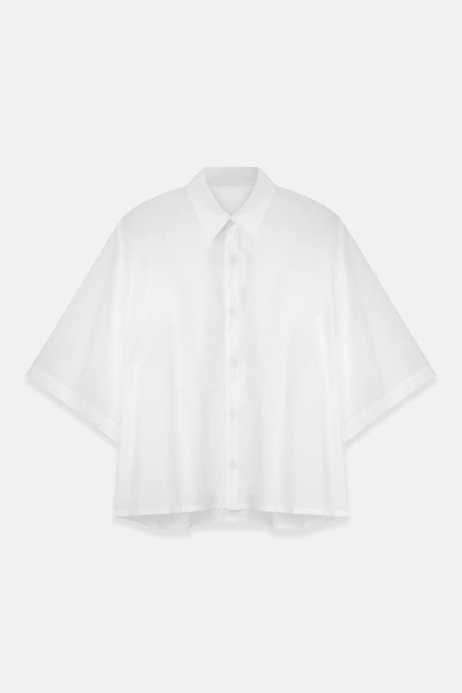 Ladies' white blouse flat lay