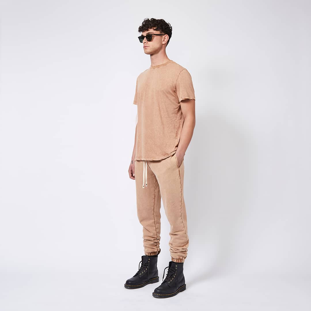 Male model with matching outfit and sunglasses