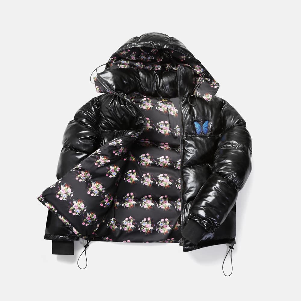 Flat lay variation of black ladies' puffer jacket